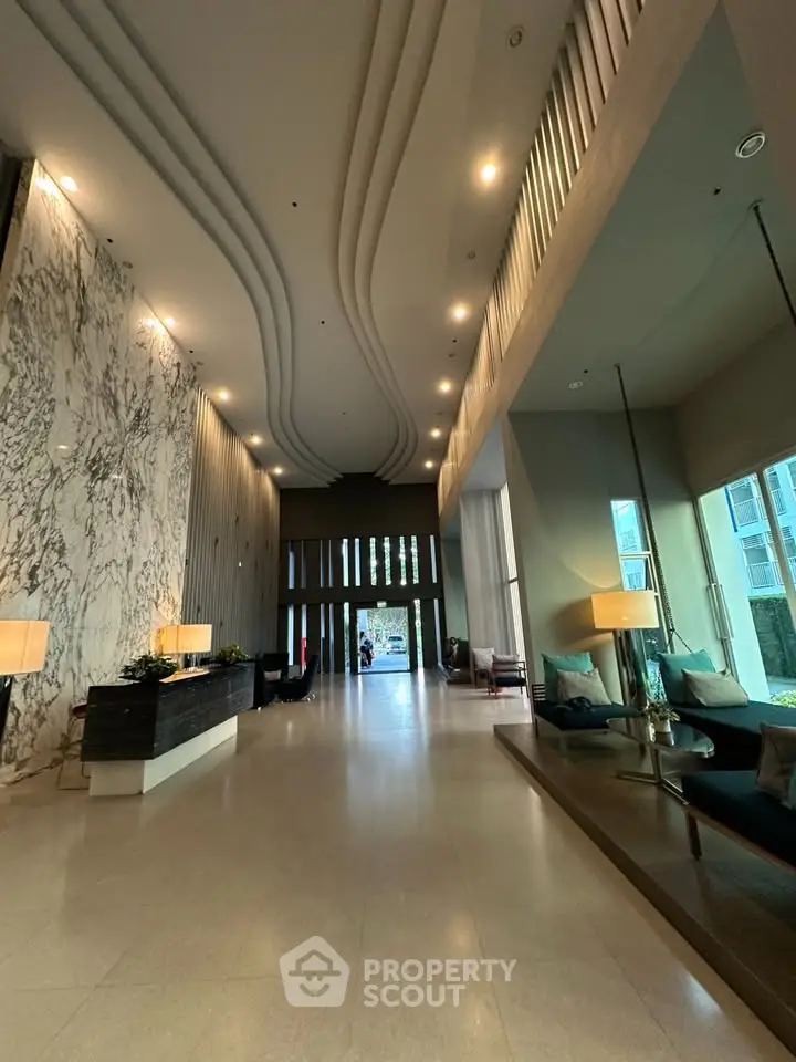 Luxurious modern lobby with high ceilings and elegant marble accents