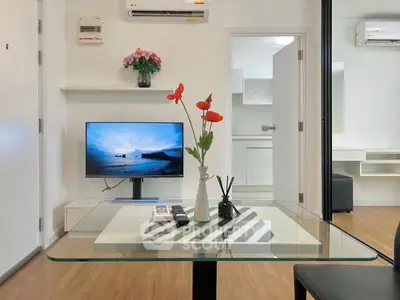 Modern living room with sleek decor and wall-mounted TV