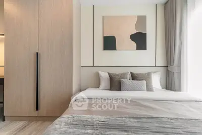 Modern bedroom with stylish decor and large wardrobe in a contemporary apartment.