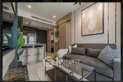 Modern living room with stylish decor and open kitchen layout