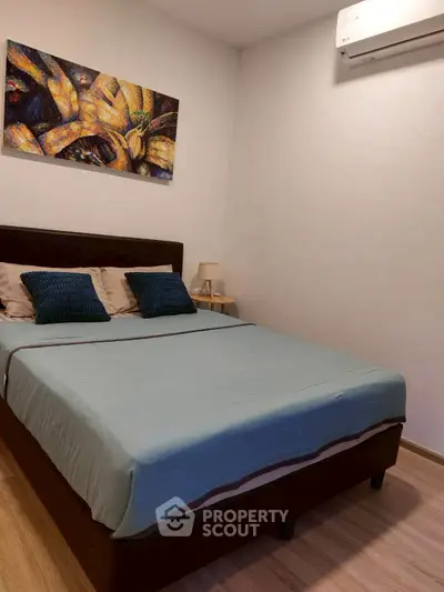 Cozy bedroom with modern decor and air conditioning