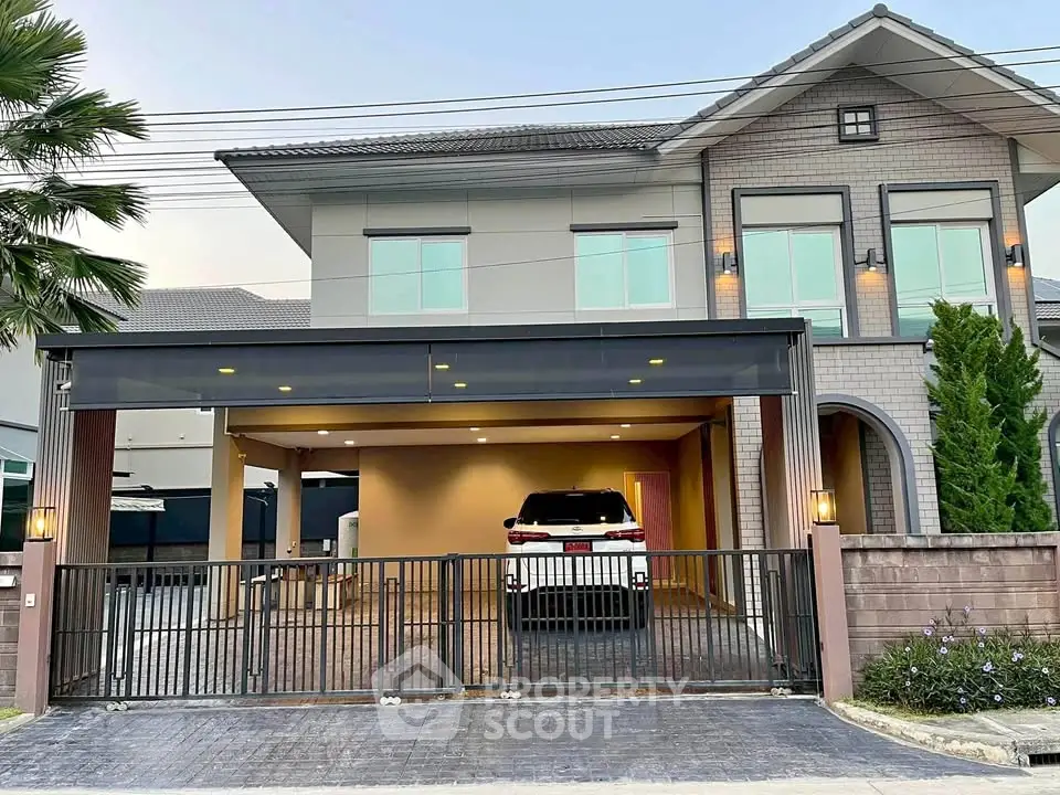 Modern two-story house with spacious driveway and carport