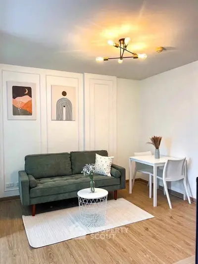 Chic living room with modern decor, stylish lighting, and cozy seating area.