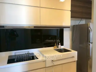 Modern kitchen with sleek appliances and minimalist design