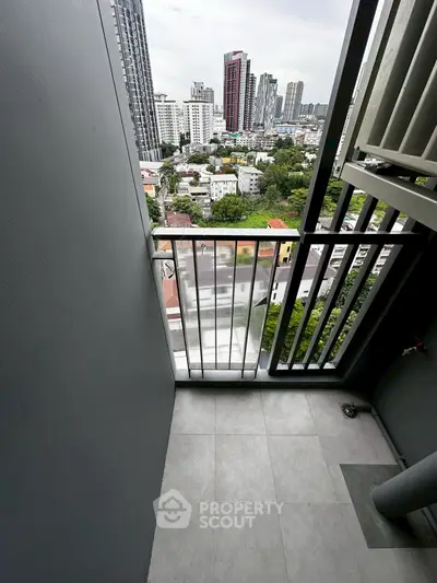 Modern high-rise balcony with stunning city view, perfect for urban living.