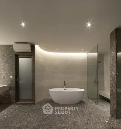 Luxurious modern bathroom with elegant freestanding bathtub and sleek design.