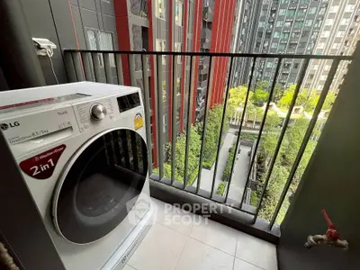 Modern balcony with washing machine and urban view in high-rise building
