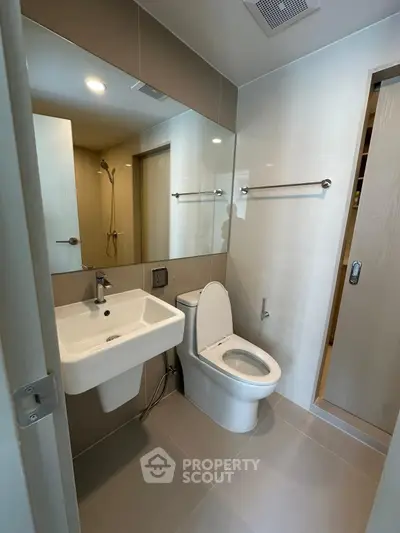 Modern bathroom with sleek fixtures and neutral tones