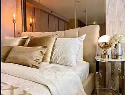 Luxurious bedroom with plush bedding and elegant lighting