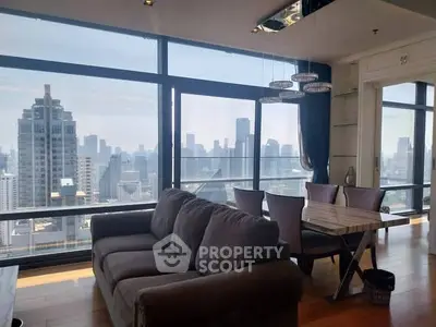 Luxurious living room with stunning city skyline view and modern furnishings