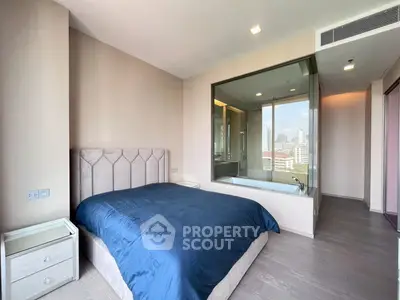 Modern bedroom with city view and luxurious bathtub