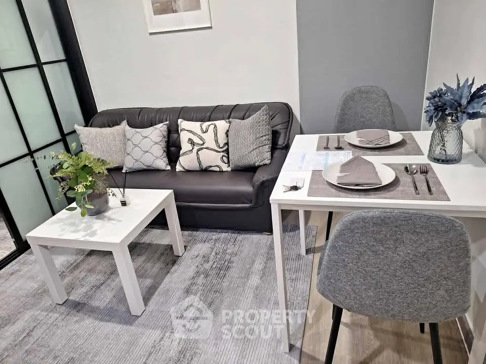Modern living room with cozy sofa and dining area in stylish apartment.