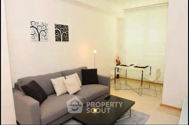 Modern living room with stylish decor and cozy seating area.