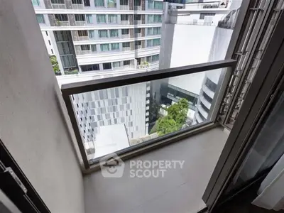 Modern high-rise balcony with urban city view, perfect for enjoying the skyline.