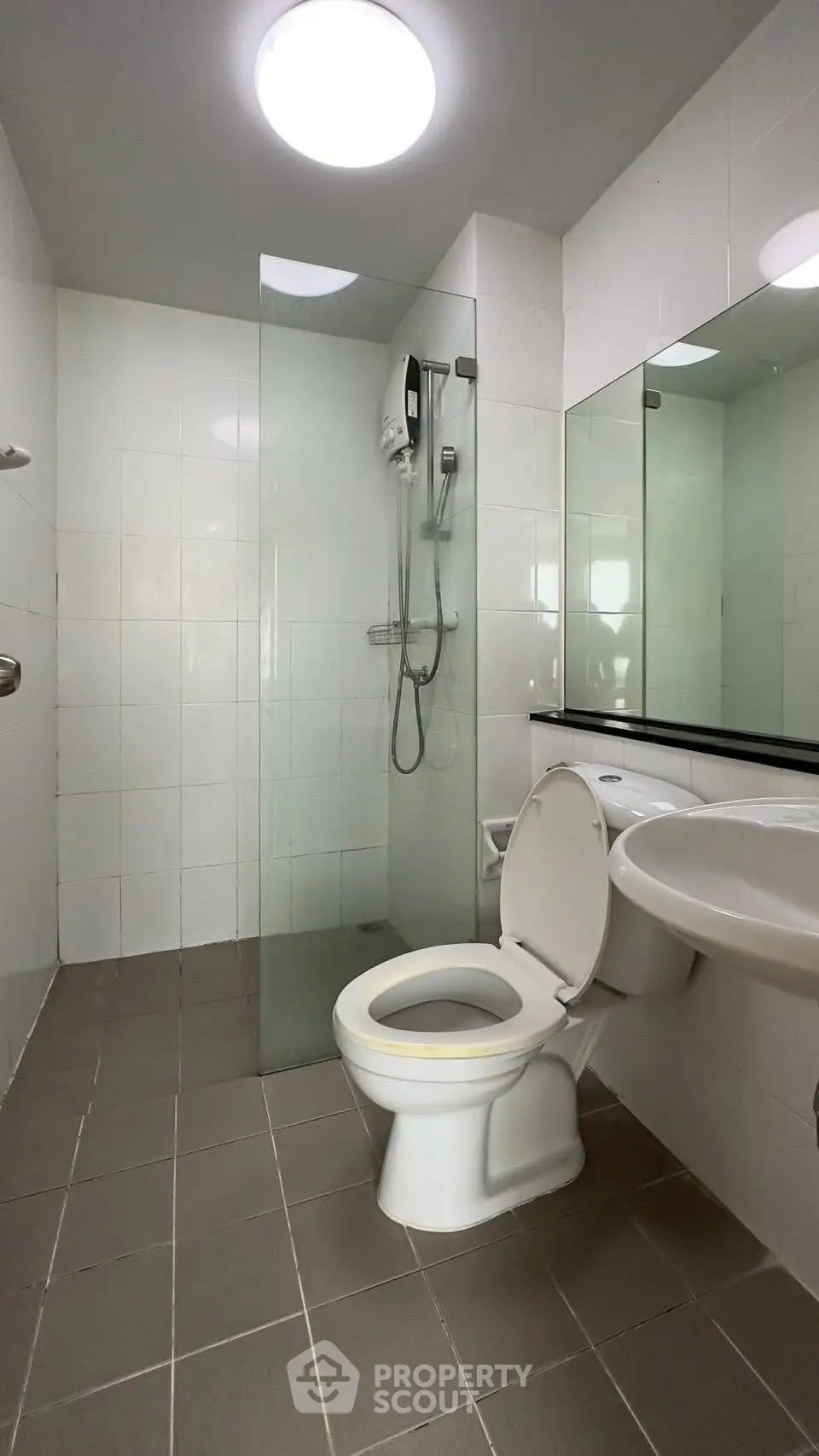 Modern bathroom with glass shower and sleek fixtures