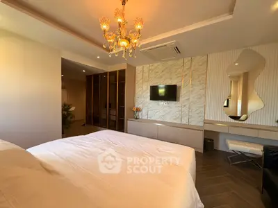 Luxurious bedroom with elegant chandelier and modern decor