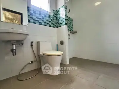 Modern bathroom with sleek fixtures and stylish tile accents
