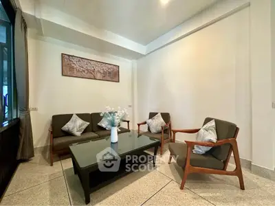 Charming living room with modern furniture and elegant decor, perfect for relaxation and entertaining guests.