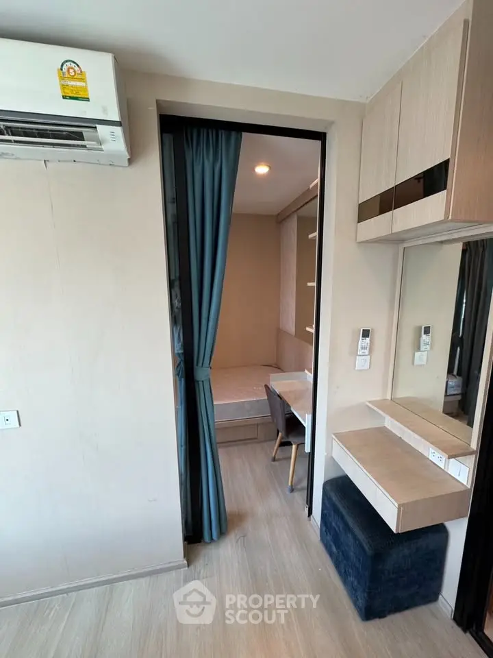 Modern compact bedroom with built-in furniture and air conditioning