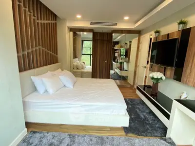 Luxurious modern bedroom with stylish decor and large mirror closet