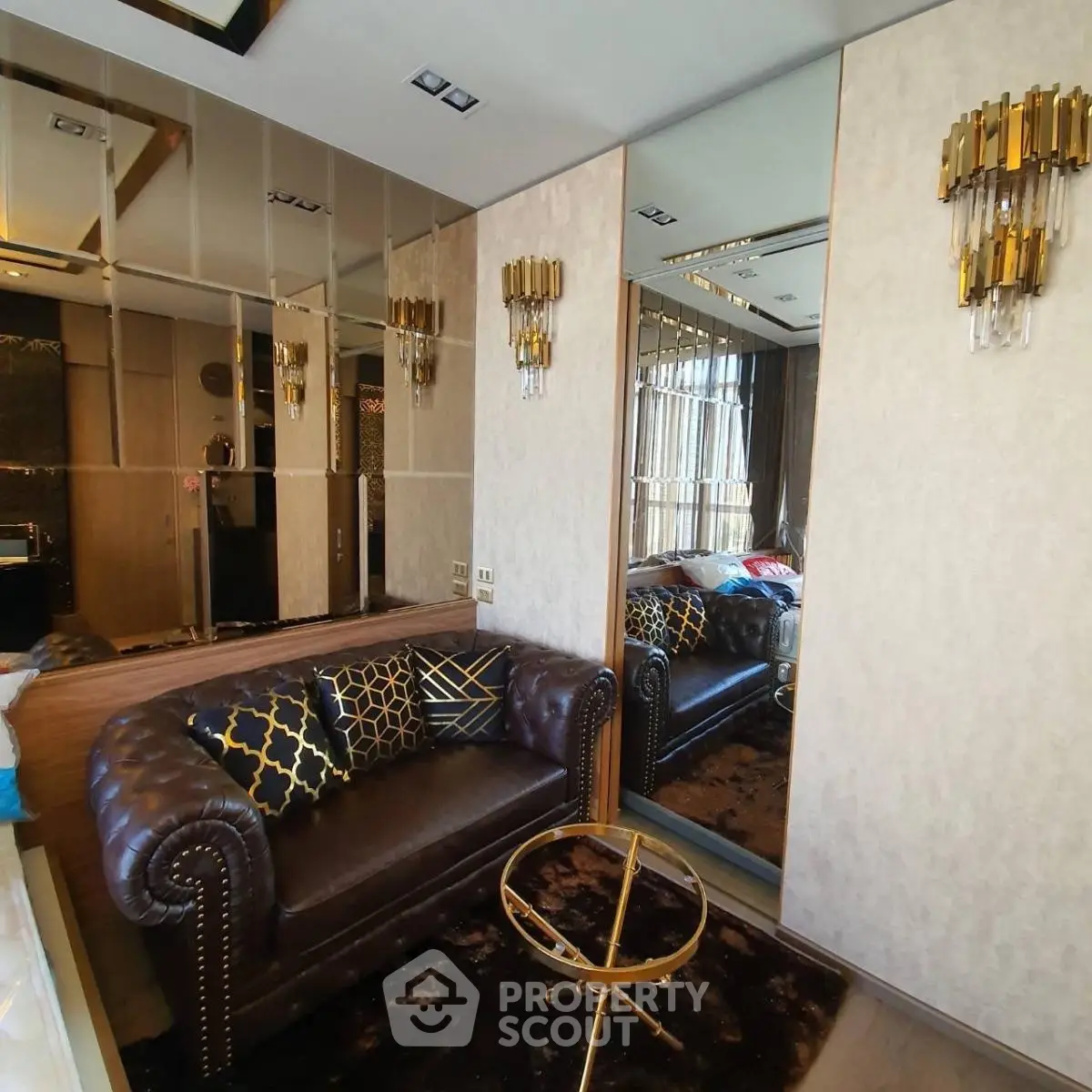 Luxurious living room with elegant leather sofa and mirrored wall accents