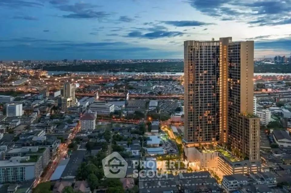Stunning high-rise building with panoramic city views at dusk.