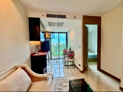 Modern apartment interior with open kitchen and balcony view