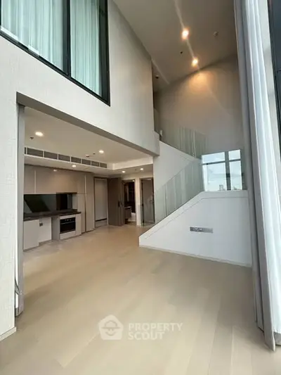 Spacious modern living room with high ceilings and sleek design