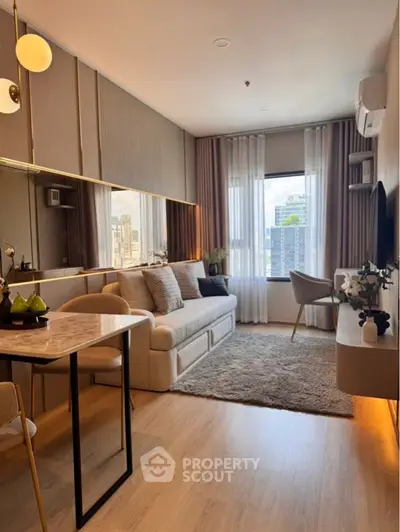 Modern living room with elegant decor and city view, featuring cozy seating and stylish furnishings.