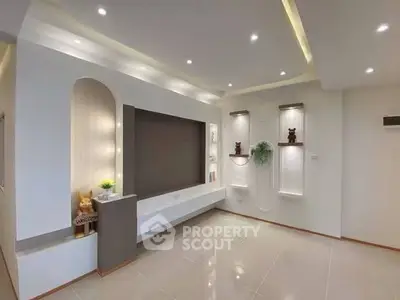 Modern living room with sleek design and ambient lighting
