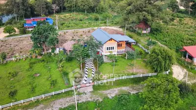 Charming countryside home with lush greenery and spacious garden, perfect for serene living.