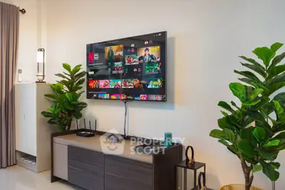 Modern living room with wall-mounted TV and stylish decor