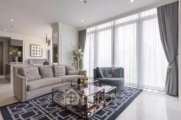 Luxurious living room with elegant decor and large windows offering abundant natural light.