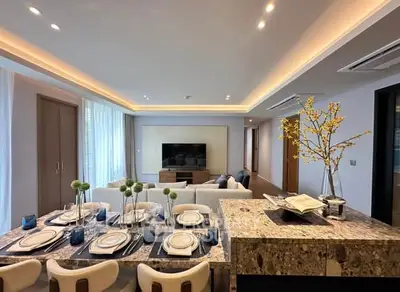Luxurious open-plan living room with elegant dining area and modern decor