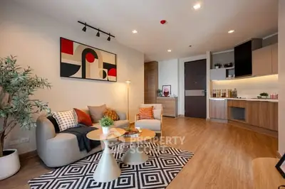 Modern living room with stylish decor and open kitchen layout