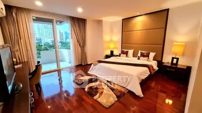 Luxurious bedroom with city view and elegant decor in prime real estate location.