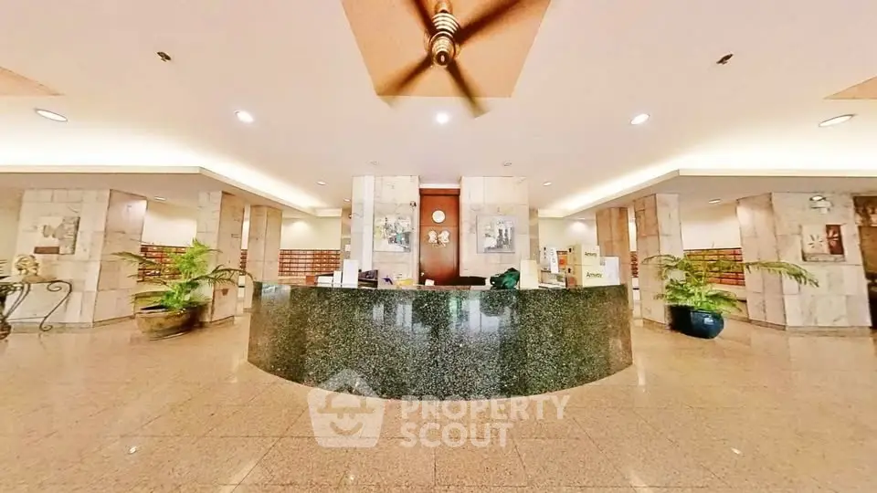 Luxurious building entrance with elegant marble decor and modern lighting