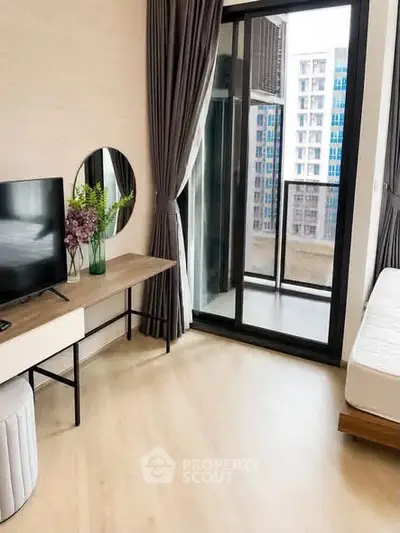 Modern bedroom with balcony access and stylish decor in urban apartment