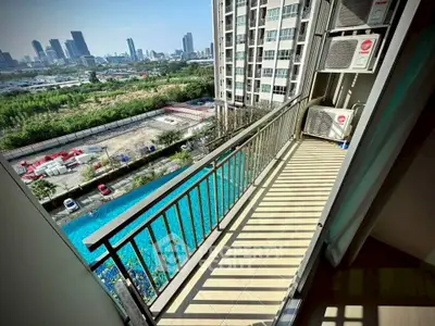Spacious balcony with city view in modern high-rise apartment