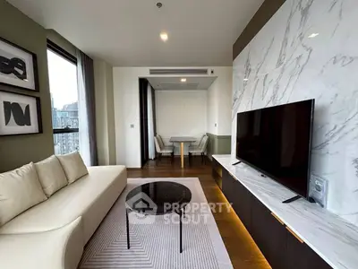 Luxurious modern living room with marble accent wall and sleek furniture