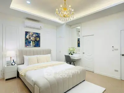 Luxurious bedroom with elegant chandelier and modern decor