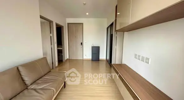 Modern living room with sleek furniture and wooden flooring