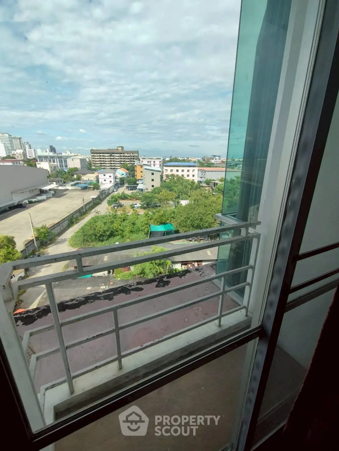 Stunning cityscape view from a high-rise balcony, perfect for urban living.