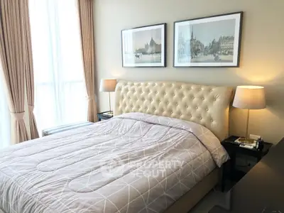 Luxurious bedroom with elegant decor and plush bedding in a modern apartment.