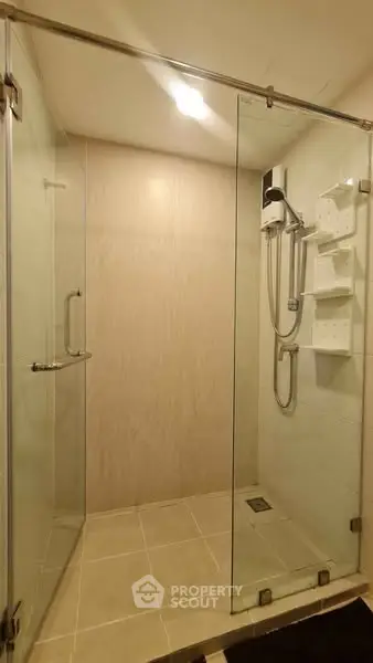 Modern bathroom with glass shower enclosure and sleek design