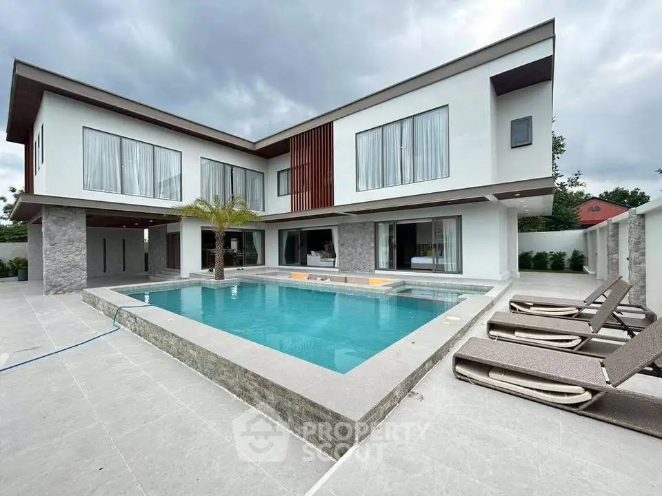 Luxurious modern villa with pool and spacious outdoor area, perfect for relaxation and entertainment.