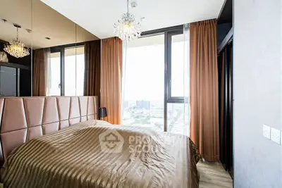 Luxurious bedroom with city view, elegant chandelier, and floor-to-ceiling windows.