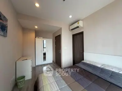 Modern bedroom with air conditioning and stylish decor in a contemporary apartment.