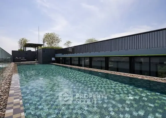 Luxurious rooftop pool with modern design and stunning city views.