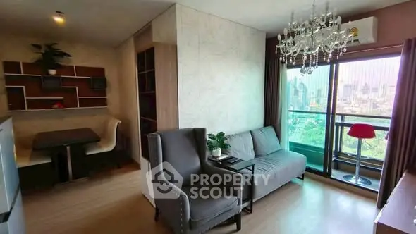 Modern living room with elegant chandelier and city view balcony
